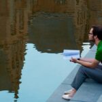 young man sitting and reading